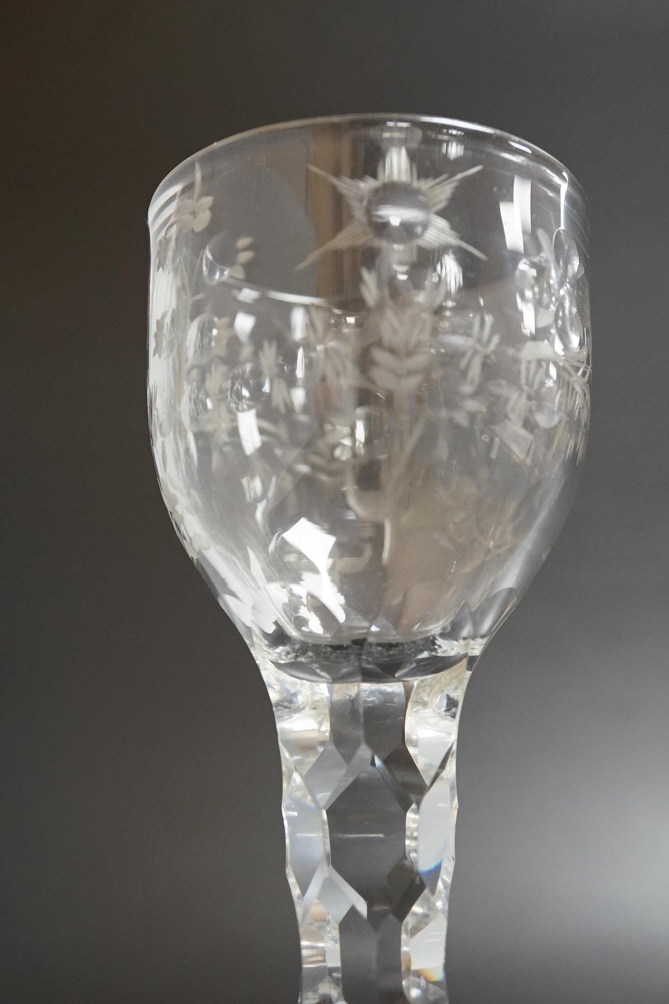 An opaque twist firing glass with terraced foot and a faceted wine glass with domed foot, c.1760, tallest 14cm